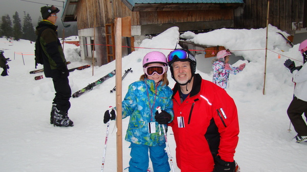 With her ski instructor, Mr. Conwell